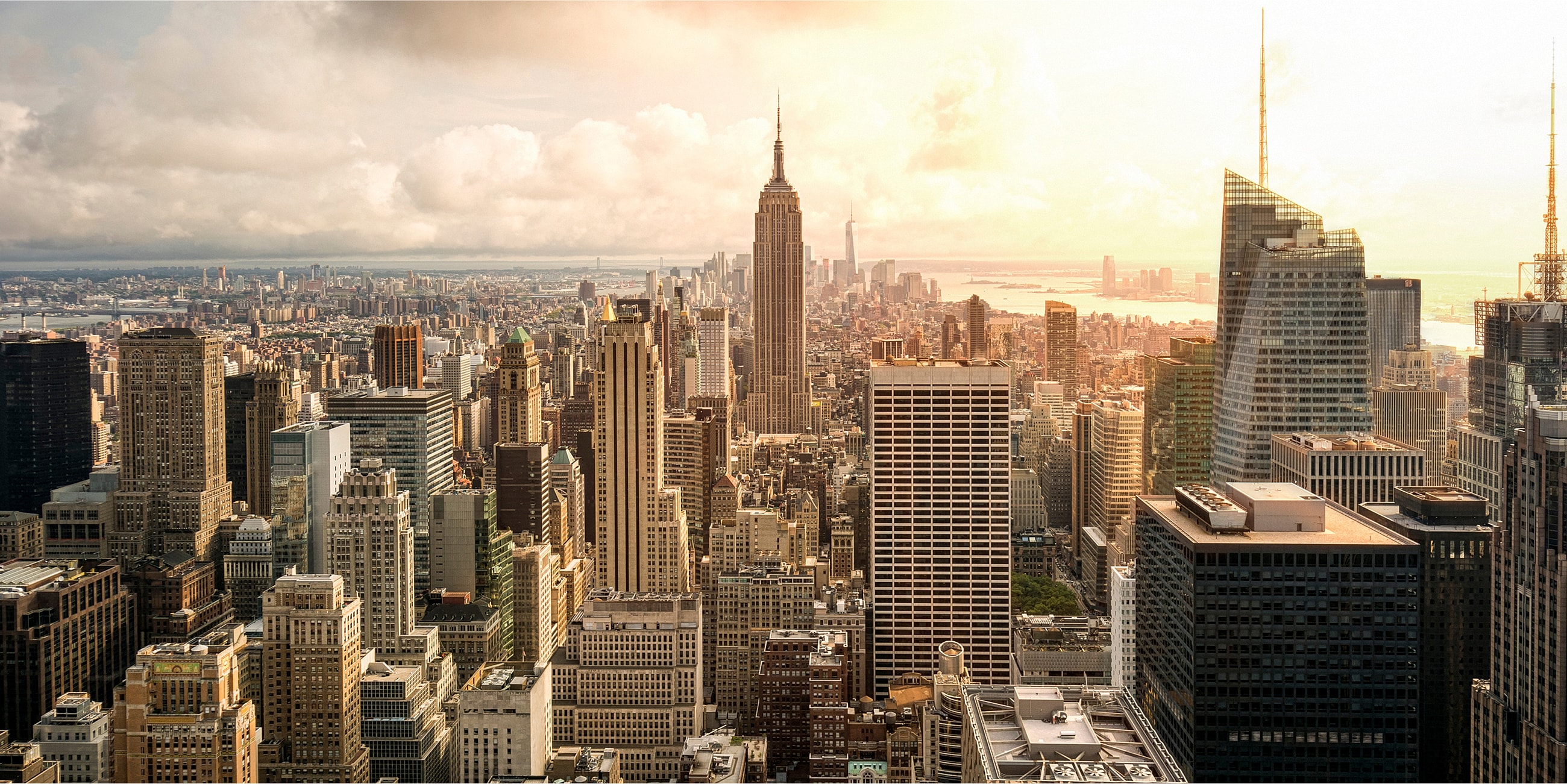 Aerial view of New York City skyline at sunset.