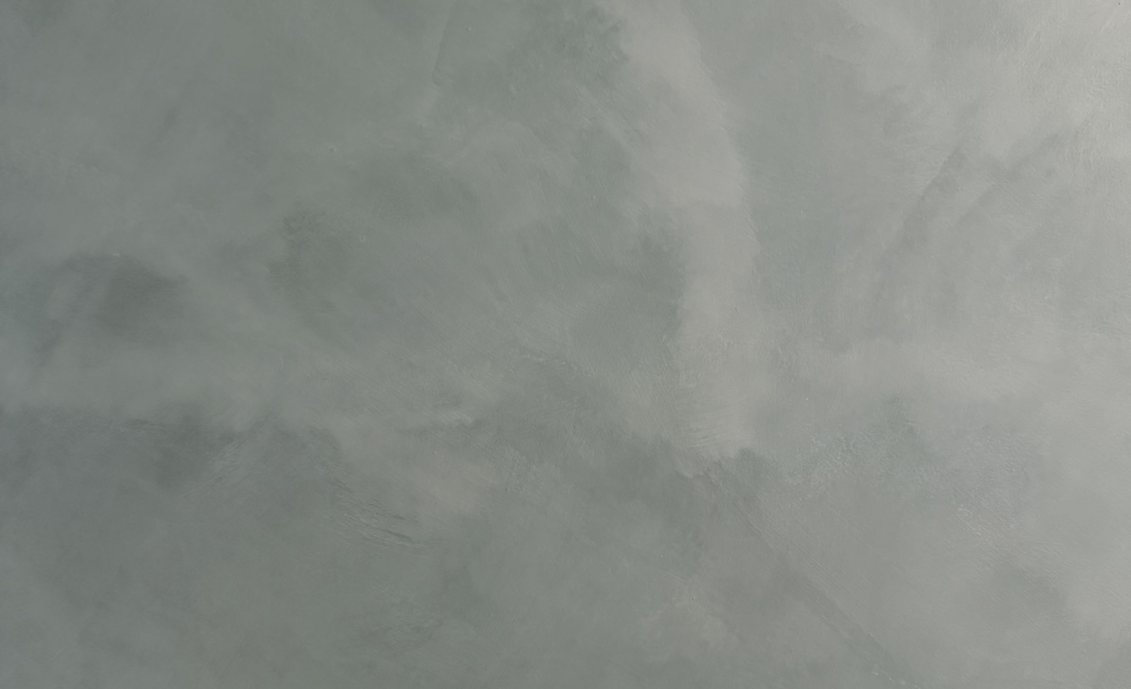 Textured gray abstract background with subtle variations.