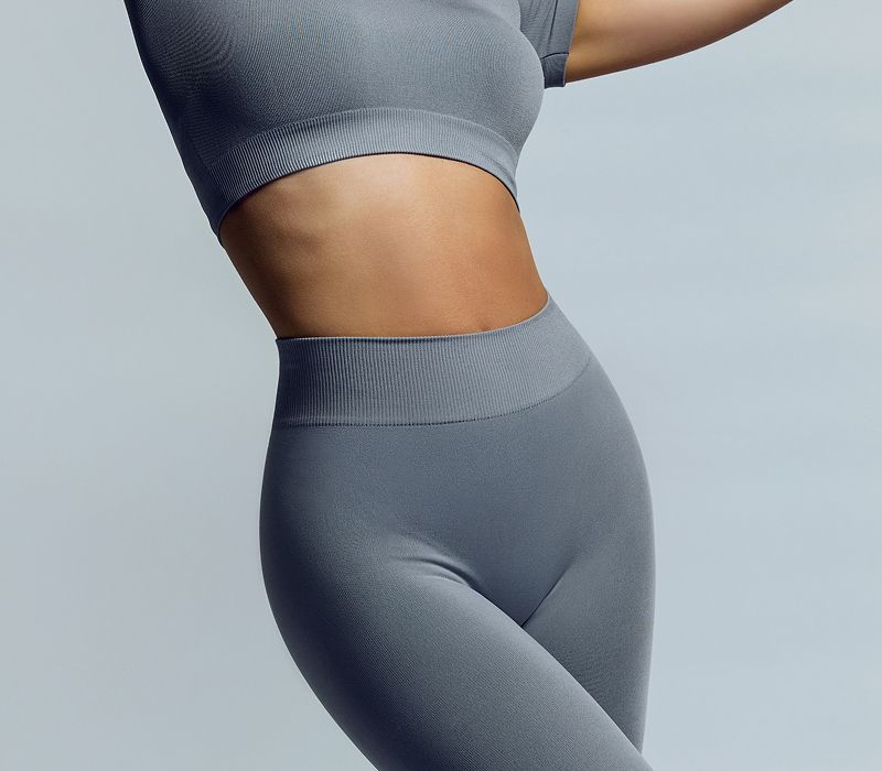 Gray activewear outfit on model.