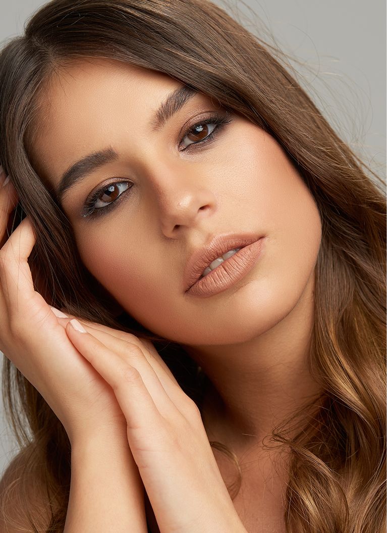 Close-up of a woman's face with soft expressions.