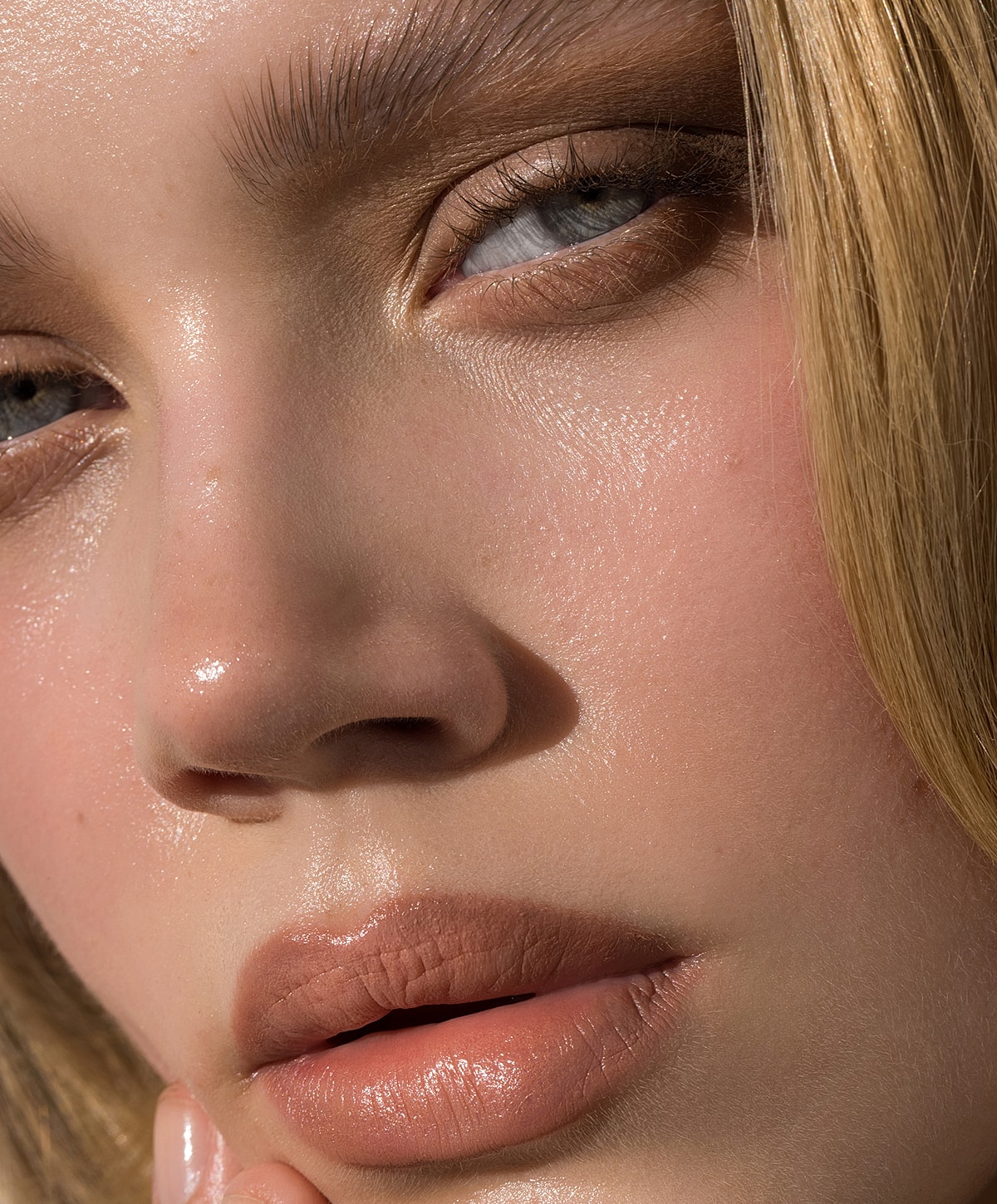 Woman with wet hair and natural makeup.