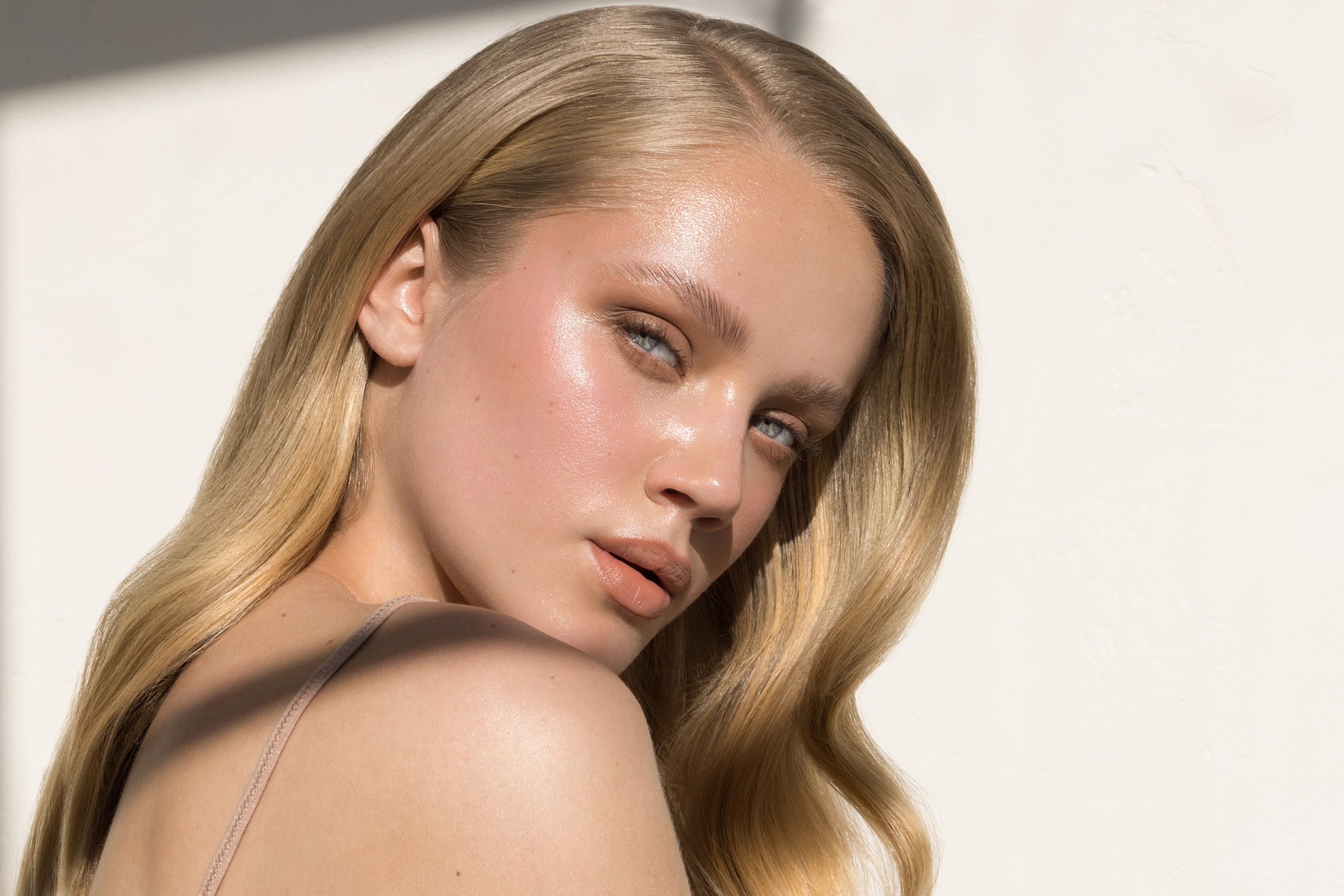 Model with long hair and natural makeup.