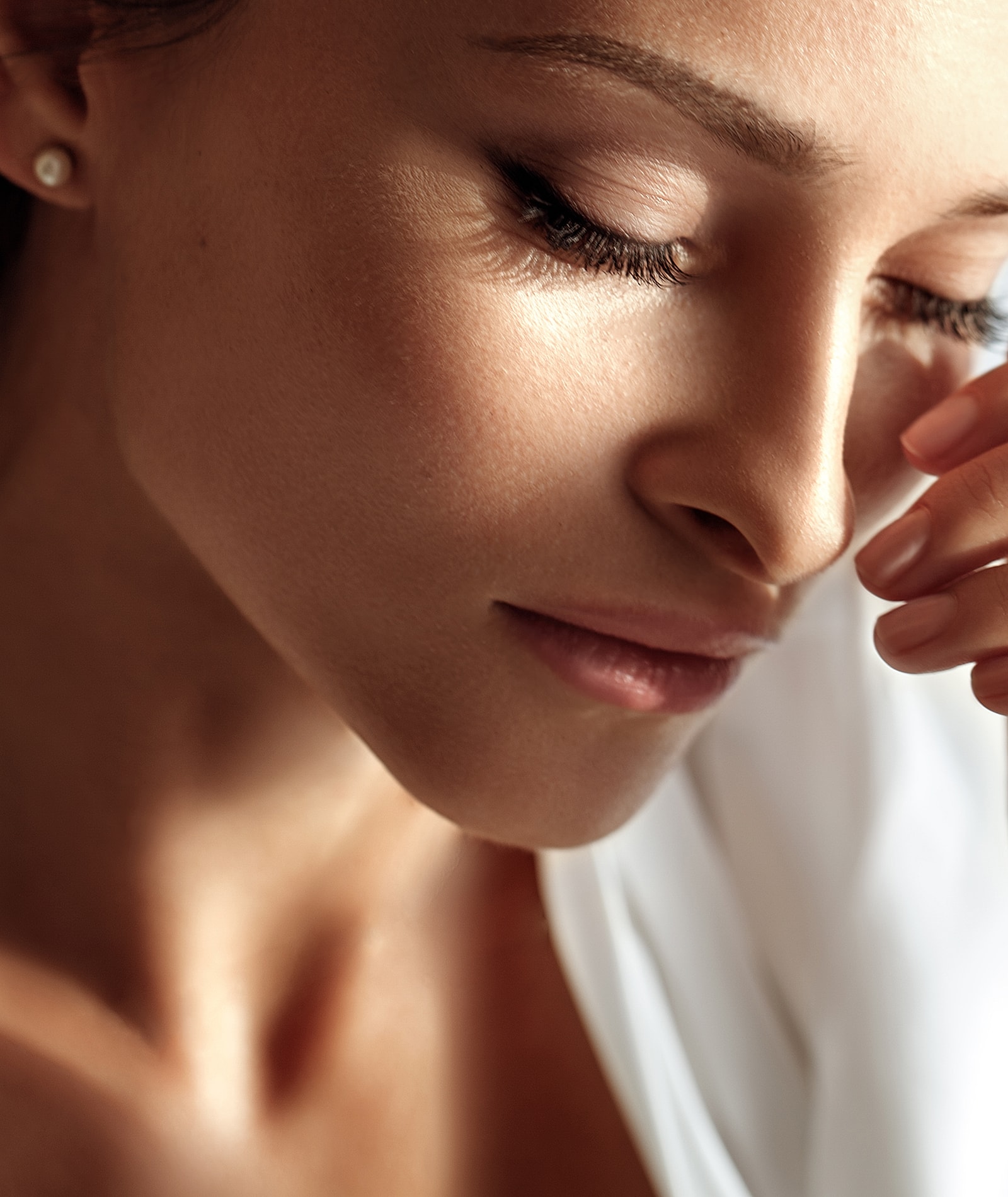 Portrait of a woman with glowing skin.