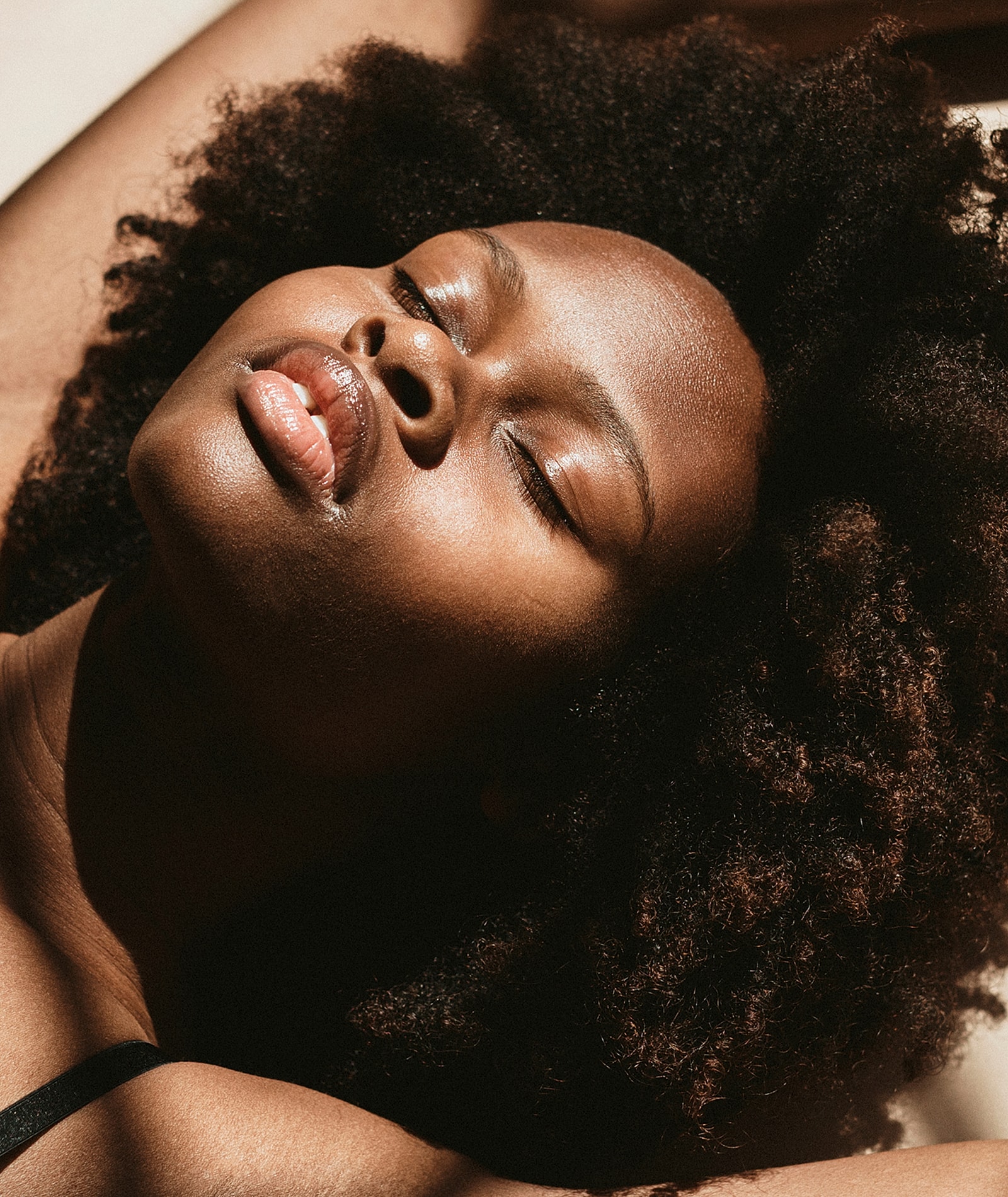 Close-up portrait of a woman with soft lighting.